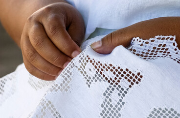 Handmade brazilian renaissance lace. Craftsman hands in close-up. Brazilian handicraft.