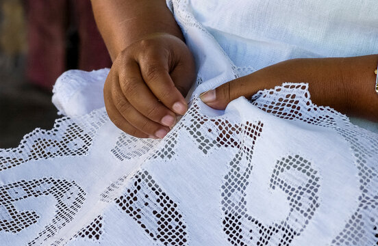 Handmade brazilian renaissance lace. Craftsman hands in close-up. Brazilian handicraft.