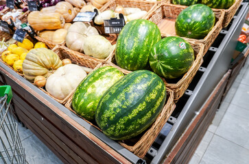 Watermelons and vegetables selling at the grocery store