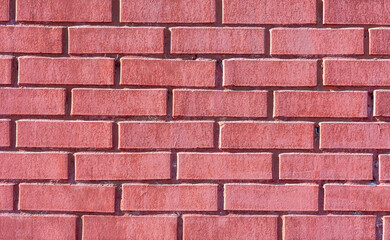 Old weathered red brick wall as background