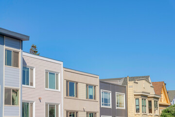 Fototapeta na wymiar Neighborhood in San Francisco, California with box roofs exterior against the clear blue sky.