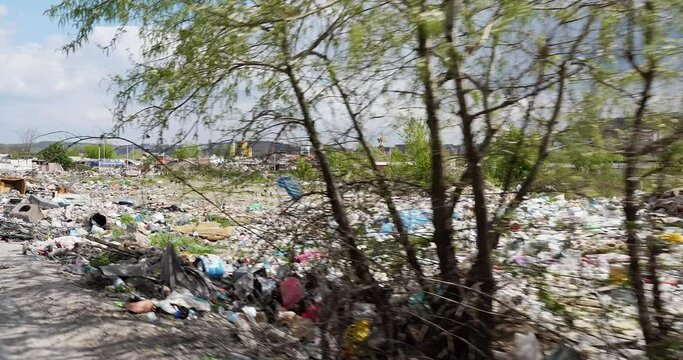 a wild landfill in the city with a lot of different garbage