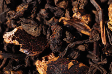 Chocolate black leaf shu pu-erh tea with cocoa beans close-up macro photography
