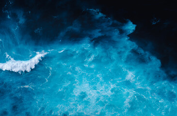 Waves crashing in the blue atlantic ocean at the coast of Madeira