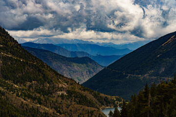 Fototapeta premium Panoramic view of the Estany de Sant Maurici and the Parc Nacional d'Aigüestortes mountains (Lleida, Spain)