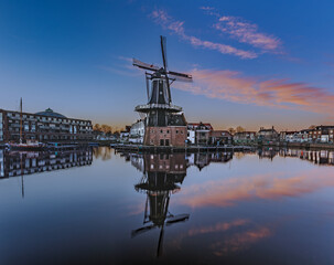 Fototapeta na wymiar Molen de Adriaan during sunrise - Haarlem, Netherlands