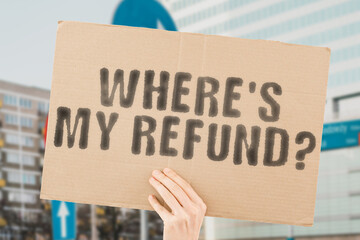 The question " Where's My Refund? " is on a banner in men's hands with blurred background. Refund. State. Irs. Payroll. Rebate. Web. Finance. Money. Service. Benefit. Internet. Bank. Return. Cash