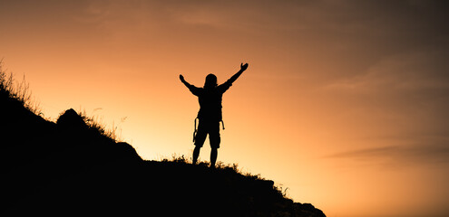 Goal setting. Male climber reaching top of mountain	