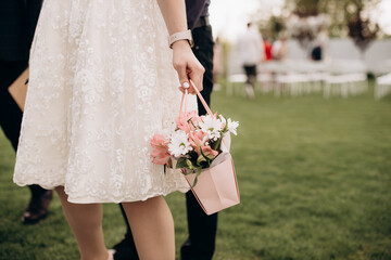 bride holding gentle wedding bouquet