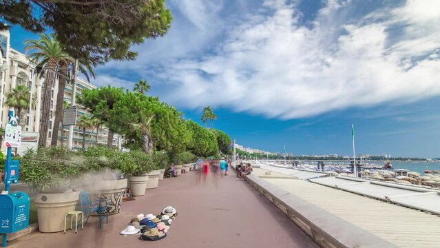 People walking at waterfront near famous La Croisette Boulevard timelapse hyperlapse. French Riviera.