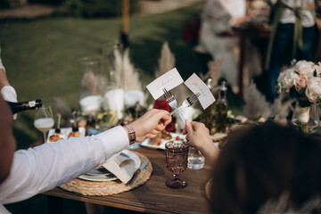 couple of newlyweds sitting at the banquet table