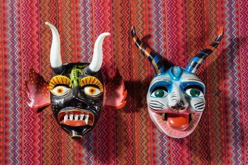 Typical devil Cusco´s masks on a traditional peru fabric