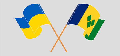 Crossed flags of Ukraine and Saint Vincent and the Grenadines. Official colors. Correct proportion