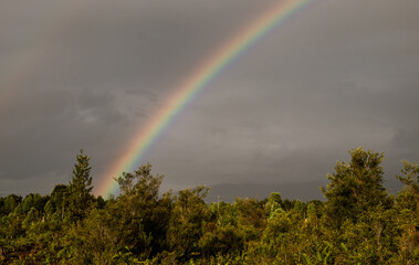 rainbow in the mountains in a rainy day 