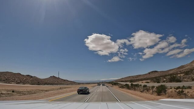 Driving along a Southern California highway on a bright sunny day