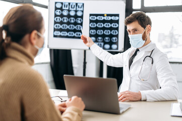 Unhealthy girl came to the doctor for a consultation. Caucasian smart doctor, therapist,...