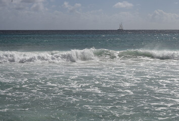 Yacht on the horizon at Hastings Barbados
