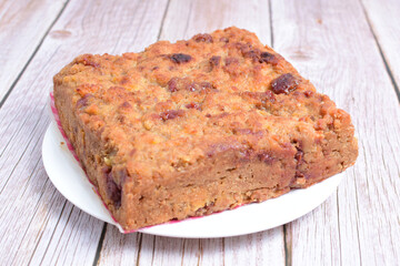 Fluffy bread cake with guava flavor on wooden background