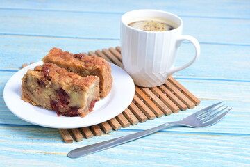 Fluffy bread cake with guava flavor accompanied by a cup of coffee on a wooden background