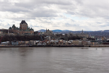 Fototapeta na wymiar View of the old Quebec city and the Frontenac castle from the south shore of the St Lawrence river at Levis