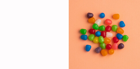 Assortment of small colored candies - Text space