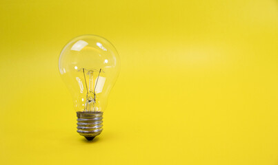 light bulb, with yellow background - ideas, imagination, action