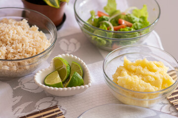 Lunch at the table with tilapia fish and mashed potatoes and salad accompanied by rice