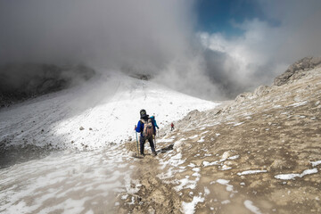 horizontal shot mountaineer descending a snow-filled route of the Iztaccihuatl - Popocatepetl National Park in Mexico