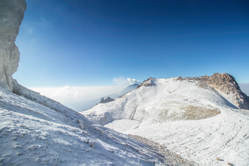 panoramic shot of the glacial snow-capped mountains and an active volcano in the background of the Iztaccihuatl - Popocatepetl National Park in Mexico