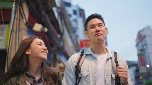 Asian attractive romantic couple travel in the city for honeymoon trip