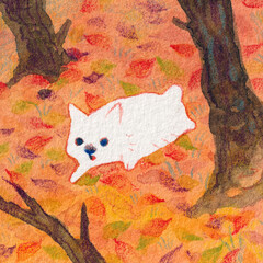 積もった落ち葉と白犬