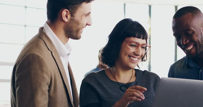 Successful teams equals successful results. 4K video footage of a group of businesspeople talking together over a digital tablet in a modern office.