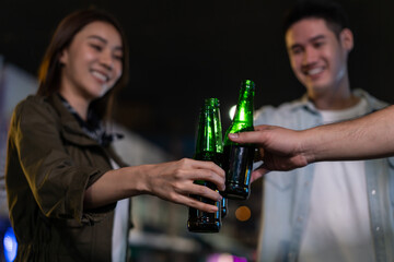 Asian attractive people drinking alcohol with friends and having party
