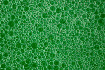 Lots of little green soap bubbles. Flat lay top view background