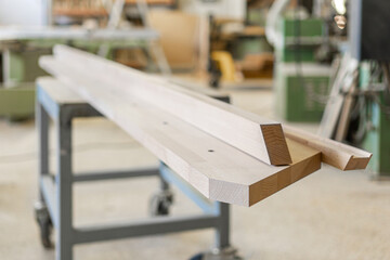 Wooden plank placed on table in joinery