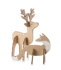 Handmade cardboard fox and reindeer toys on white background © Pixel-Shot