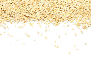 Scattered raw oatmeal on white background