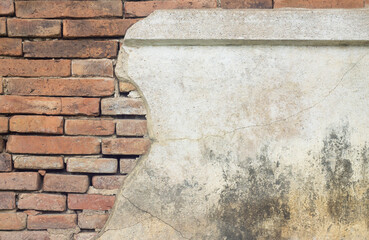 Old brick wall with peeled plaster, grunge background.