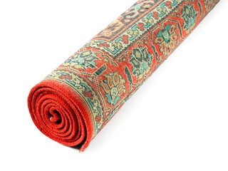 Rolled vintage carpet on white background, closeup