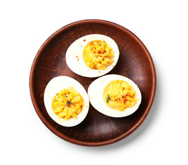 Plate with tasty stuffed eggs on white background. Easter celebration