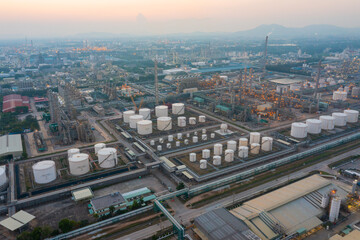 Fototapeta na wymiar Aerial view of petrochemical oil refinery and sea in industrial engineering concept in Bangna district at night, Bangkok City, Thailand. Oil and gas tanks pipelines in industry. Modern metal factory.
