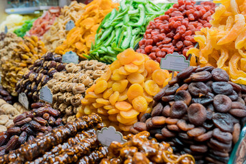 Close up of display with traditional turkish delights, dried fruits and nuts at Egyptian Bazaar. Best delicious turkish foods to try on trip to Istanbul. Selective focus - obrazy, fototapety, plakaty