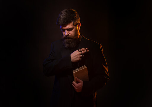 Praying Hands Priest Portrait Of Male Pastor. Man In Suit With A Bible. Pastor Or Preacher Praying, Priest Portrait Of Male Pastor.