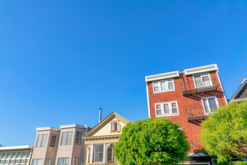 Fototapeta na wymiar Residential buildings in a low angle view against the clear sky in San Francisco, California