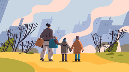 Ukrainian refugees with things fleeing russian aggression against Ukraine stop war concept people searching new homes