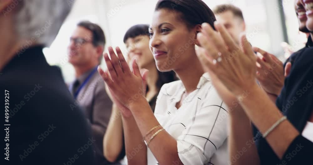 Poster Expand your knowledge. 4k footage of a group of businesspeople clapping hands while sitting in a conference.