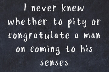 Chalk wise inscription on black chalkboard © iushakovsky