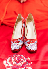 shoes and red rose petals