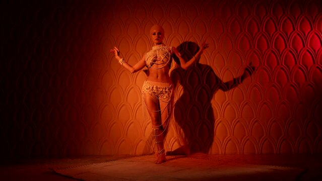 tempting concubine in arabian harem, sexy woman is dancing oriental dance, sexuality and sensuality