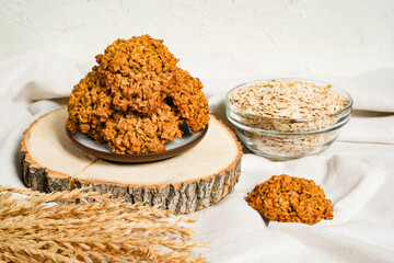 The oatmeal cookies, healthy breakfast cereal oat crackers and oat flakes. Crispy anzac biscuit cookie on rustic table